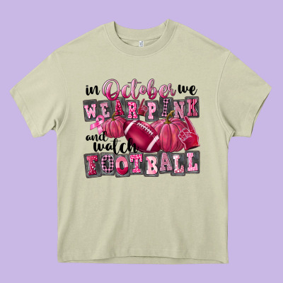 In October We Wear Pink And Watch Football Heavy Core Tee Designed By Fadigitalartstudio
