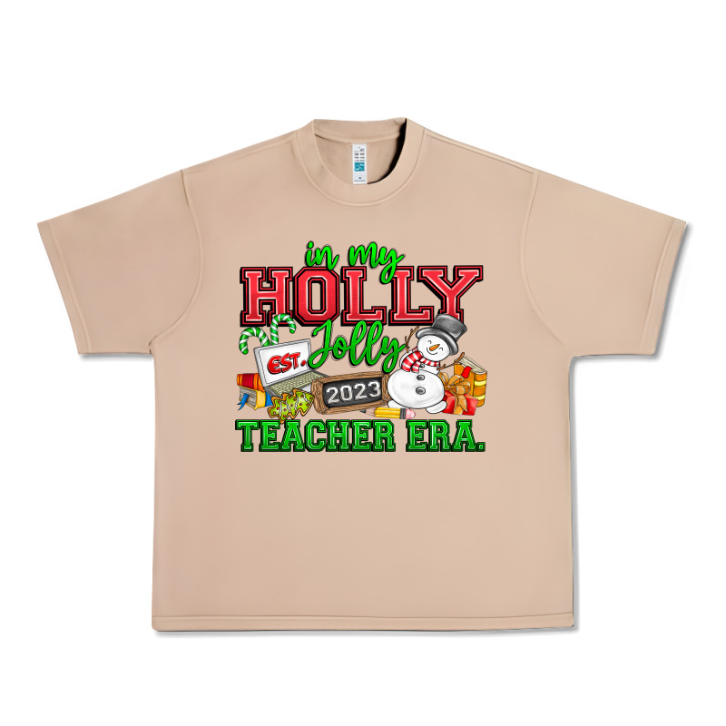 In My Holly Jolly Teacher Era Urban Heavy Tee by CowhideDigitalArt | Teevron
