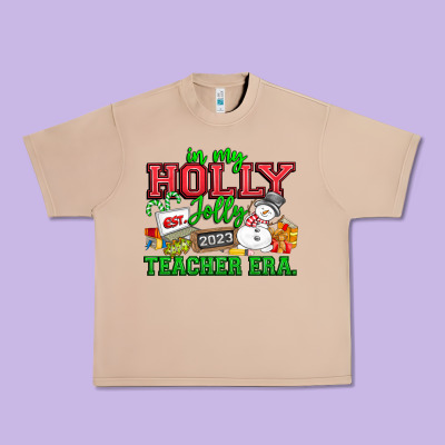 In My Holly Jolly Teacher Era Urban Heavy Tee Designed By Cowhidedigitalart
