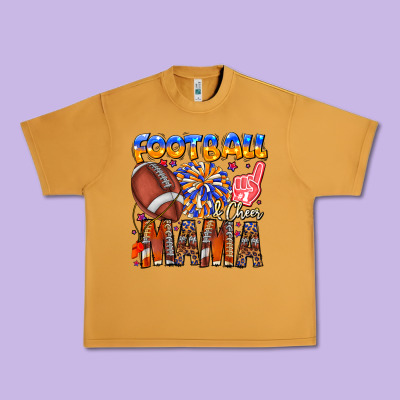 Football Mama Urban Heavy Tee Designed By Cowhidedigitalart