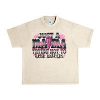 Sandshell Just a Mama Out Here Trying Not To Raise Assholes Urban Heavy Tee - CowhideDigitalArt