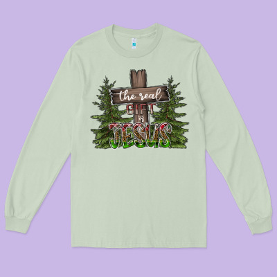 The Real Gift Is Jesus Long Sleeve Tee Designed By Cowhidedigitalart