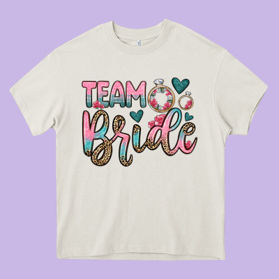 Team Bride Heavy Core Tee Designed By Oliviacreatesart