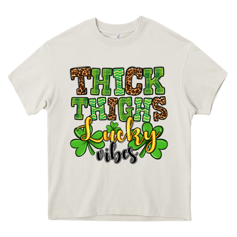 St. Patrick's Thick Thighs Lucky Vibes Heavy Core Tee by OliviaCreatesArt | Teevron