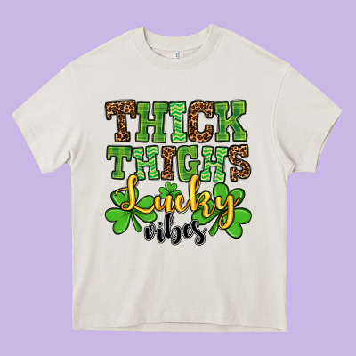 St. Patrick's Thick Thighs Lucky Vibes Heavy Core Tee Designed By Oliviacreatesart