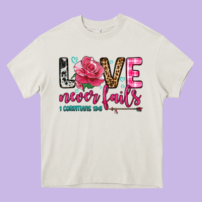 Love Never Fails Heavy Core Tee Designed By Oliviacreatesart