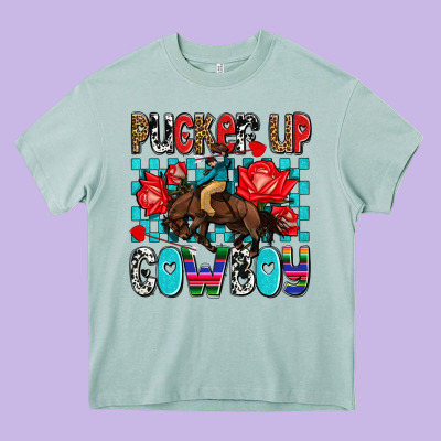 Pucker Up Cowboy Olivia Heavy Core Tee Designed By Oliviacreatesart
