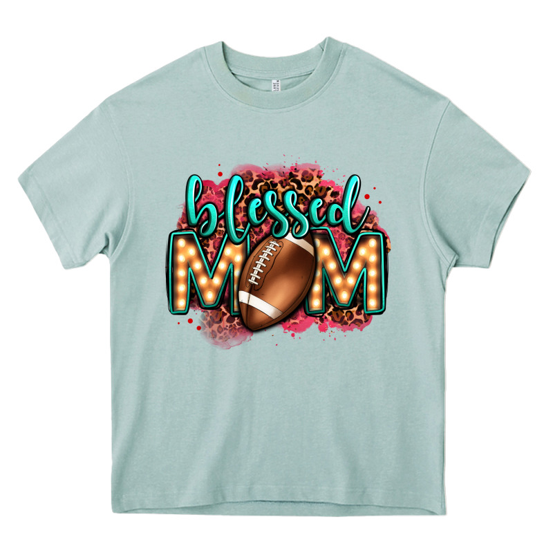 Blessed American Football Mom Lightbulb Letters Heavy Core Tee by OliviaCreatesArt | Teevron