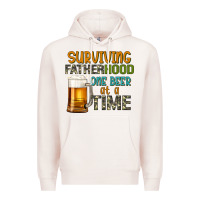 Pale Pink surviving fatherhood one beer at a  time Premium Hoodie - Artiststas