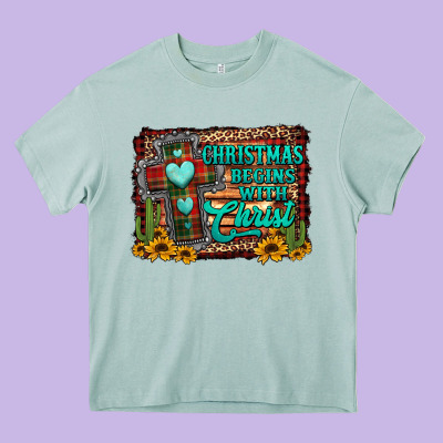 Christmas Begins With Christ Cross Heavy Core Tee Designed By Jasminsmagicworld