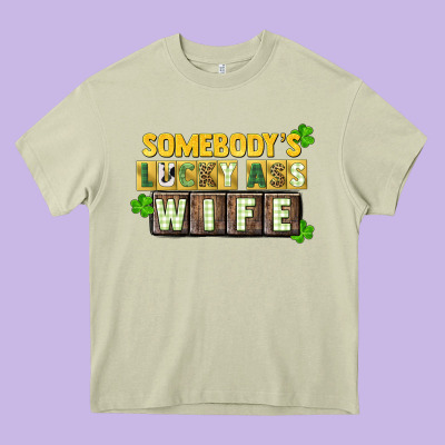 St. Patrick's Somebody's Lucky Ass Wife Heavy Core Tee Designed By Cowgirlartshop