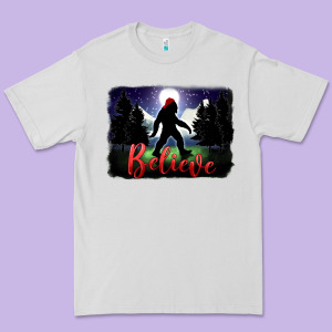 Bigfoot Believe Christmas Premium Tee Designed By Fadigitalartstudio