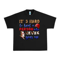 Black It's Hard To Beat A Person Who Never Gives Up Urban Heavy Tee - BundleAndBundleShop