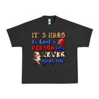 Pigment Black It's Hard To Beat A Person Who Never Gives Up Urban Heavy Tee - BundleAndBundleShop
