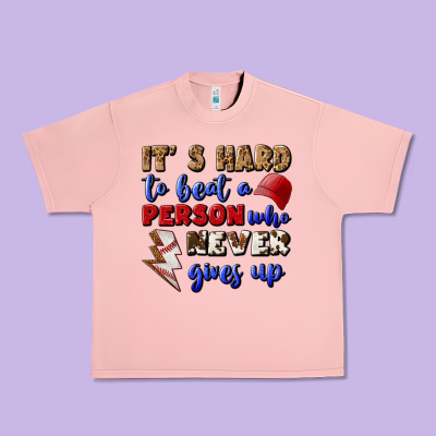 It's Hard To Beat A Person Who Never Gives Up Urban Heavy Tee Designed By Bundleandbundleshop