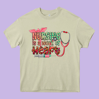 Nursing Is A Work Of Heart Heavy Core Tee Designed By Cowgirlartshop