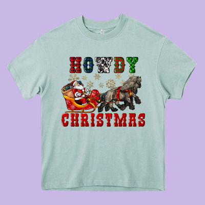 Howdy Christmas With Santa Riding His Sleighs Heavy Core Tee Designed By Cowgirlartshop